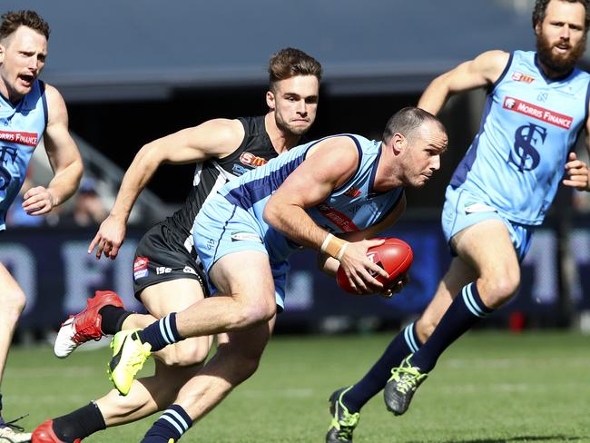 SANFL - Grand Final - Port Adelaide v Sturt at Adelaide Oval. Zane Kirkwood runs forward with Will Snelling in pursuit. Picture Sarah Reed