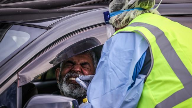 Medical staff at a pop-up COVID-19 testing clinic perform tests on drivers in the Sydney suburb of Casula, after a small cluster of cases waere linked to a venue in the western Sydney suburb. Picture: Getty