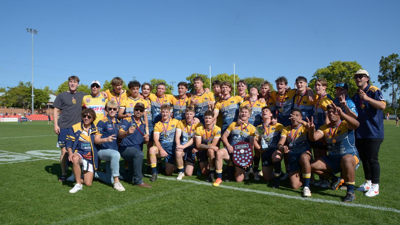 Highfields Eagles Under 19 men celebrate their premiership win.