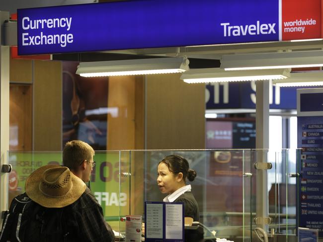 FILE - In this Monday, June 7, 2010, file photo, a Travelex Group currency exchange booth is shown at Seattle-Tacoma International Airport in Seattle. A week after a malicious virus infected its network, the London-based foreign currency exchange company Travelex has yet to restore digital sales and was reported infected with ransomware by hackers threatening to release personal data unless it pays a $3 million ransom. In a Jan. 2, 2020, Twitter post, the company said the virus had compromised some of its services on New Yearâ€™s Eve and that it took all systems offline immediately. (AP Photo/Ted S. Warren, File)