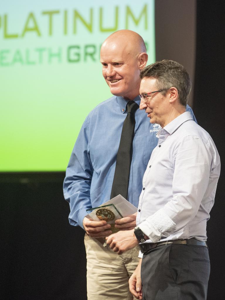 Tony Coonan receives the Volunteer of the Year award from Roland Owen, Platinum Health Group. Sports Darling Downs Sports Stars of the Year dinner. Saturday, February 11, 2023. Picture: Nev Madsen.