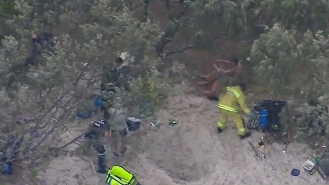 Family and friends raced to dig him out of the sand. Picture: Nine News