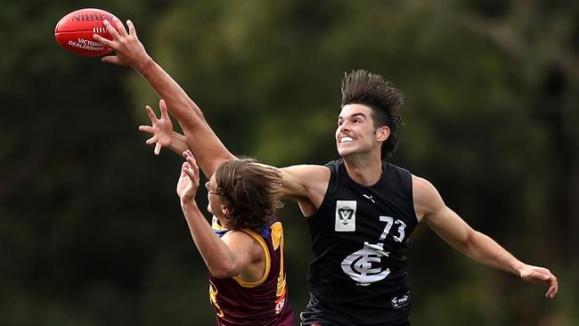 MELBOURNE, AUSTRALIA - APRIL 24: Alex Mirkov of Carlton (R) competes in the air during the round two VFL game between the Carlton Blues and the Brisbane Lions at Ikon Park on April 24, 2021 in Melbourne, Australia. (Photo by Graham Denholm/AFL Photos)