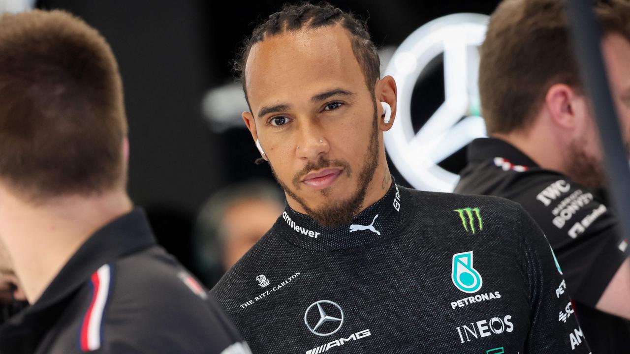 Mercedes' British driver Lewis Hamilton (C) looks on during the third practice session ahead of the 2023 Saudi Arabia Formula One Grand Prix at the Jeddah Corniche Circuit in Jeddah on March 18, 2023. (Photo by Giuseppe CACACE / AFP)