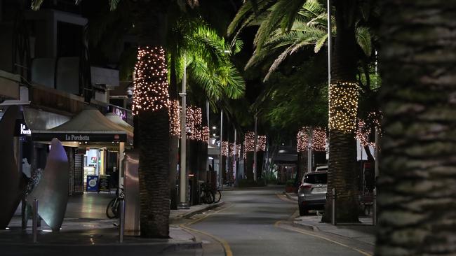 No it’s not early morning. This is the scene in Surfers Paradise between 8pm and 9pm last month. There was hardly a soul around, even in the heart of Surfers Paradise at the corner of Cavill Ave and Surfers Paradise Boulevarde. Picture: Glenn Hampson.