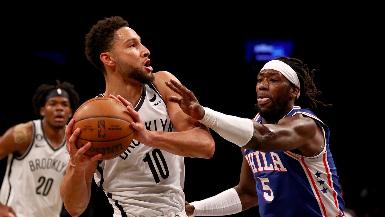 NEW YORK, NEW YORK - OCTOBER 03: Ben Simmons #10 of the Brooklyn Nets tries to keep the ball from Montrezl Harrell #5 of the Philadelphia 76ers in the first half during a preseason game at Barclays Center on October 03, 2022 in the Brooklyn borough of New York City. NOTE TO USER: User expressly acknowledges and agrees that, by downloading and or using this photograph, User is consenting to the terms and conditions of the Getty Images License Agreement. (Photo by Elsa/Getty Images)