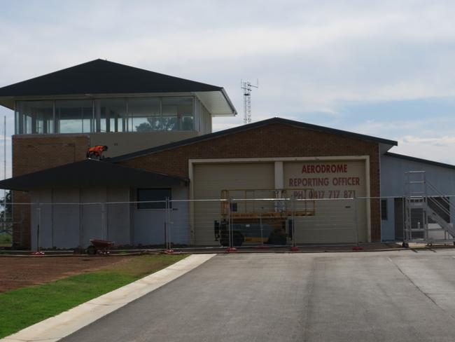 Tradies work to complete a major refurb of the Airservices building which is understood to have been used by air traffic controllers in the past. Picture: Ryan Young