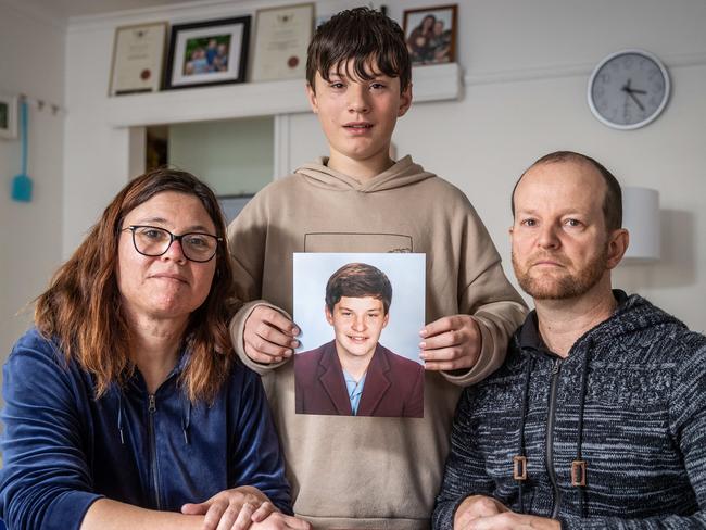 Bochara fatal crash where four people were killed in a car accident. Hamilton. The Elmes family hold a photo of Joshua Elmes (15) who died in the car accident. (L-R) Mother Lee Ann (41), brother Aaron (12) and father Matthew (46). Picture: Jake Nowakowski