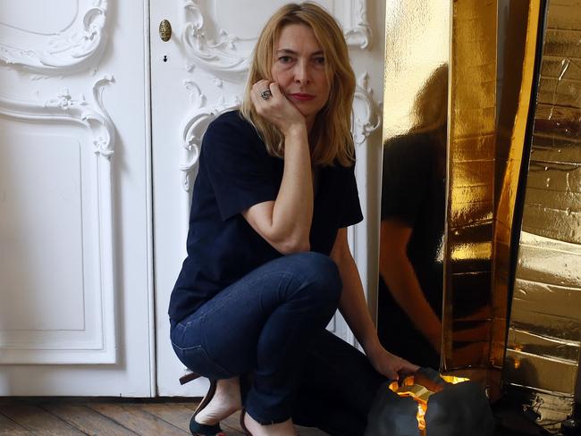 French lighting designer Odile Soudant poses next to her creations in her studio in Paris. Picture: AP Photo/Francois Mori