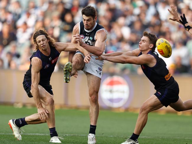 George Hewett boots the ball inside 50 in the final term of the Blues’ controversial win over Fremantle. Picture: Michael Willson/AFL Photos via Getty Images.