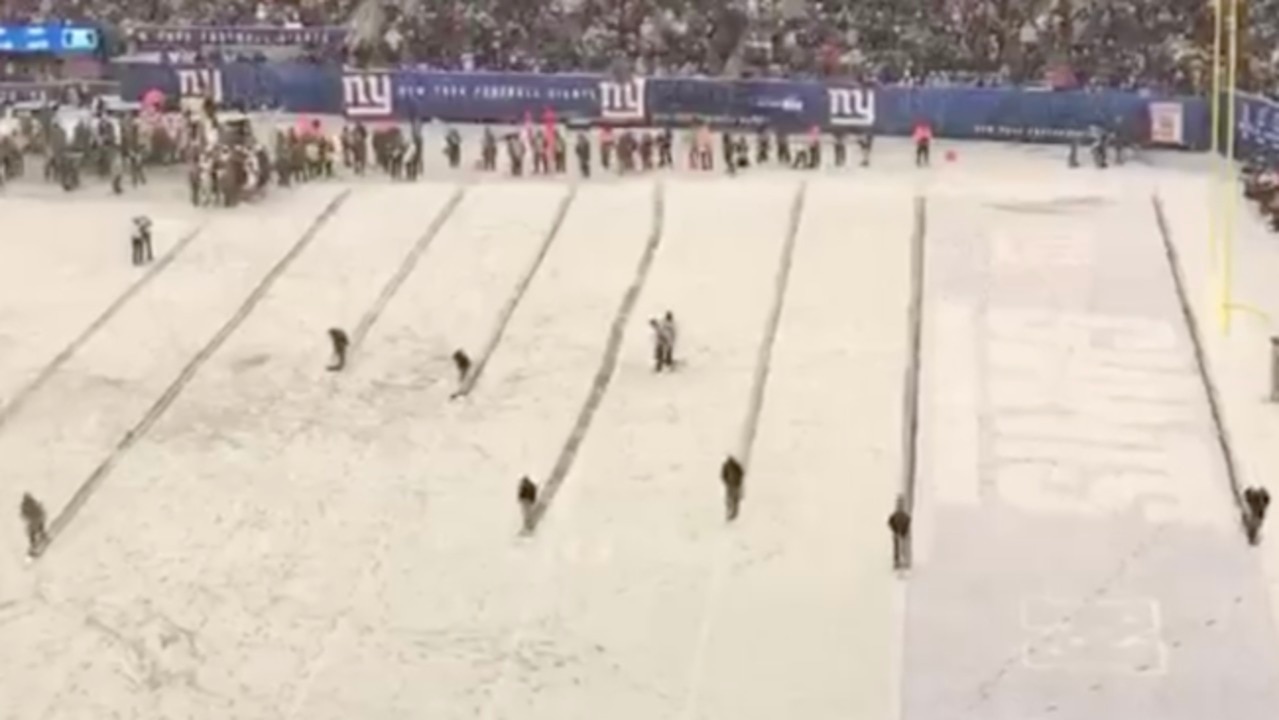 The MetLife Stadium field crew had a busy day shoveling snow at the Packers-Giants  game