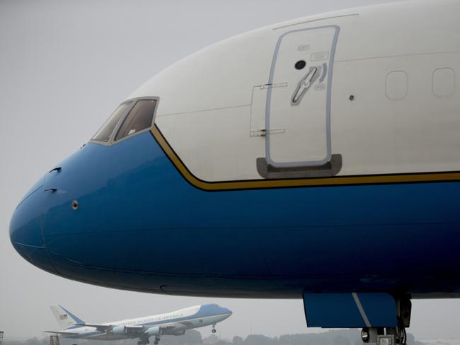 Secretary of State Mike Pompeo's plane is visible, foreground, as Air Force One with President Donald Trump aboard, below, takes off at Nom Bar International Airport in Hanoi, Vietnam to travel to Washington. Picture: AP 