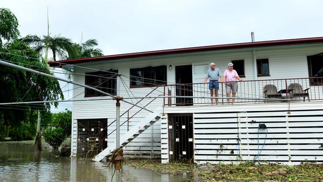 Townsville floods. Aftermath in Hermit Park. Neville and Gail Mosch survey their back yard, which overlooks Ross River, in the home they survived Cyclone Althea in 1971. Picture: Evan Morgan