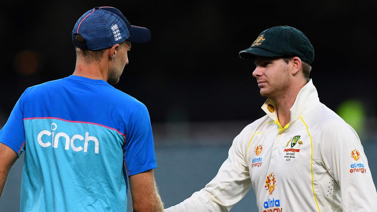 Australia's captain Steve Smith (R) shakes hands with England's captain Joe Root after a victory in the second cricket Test match of the Ashes series at Adelaide Oval on December 20, 2021, in Adelaide. (Photo by William WEST / AFP) / -- IMAGE RESTRICTED TO EDITORIAL USE - STRICTLY NO COMMERCIAL USE --