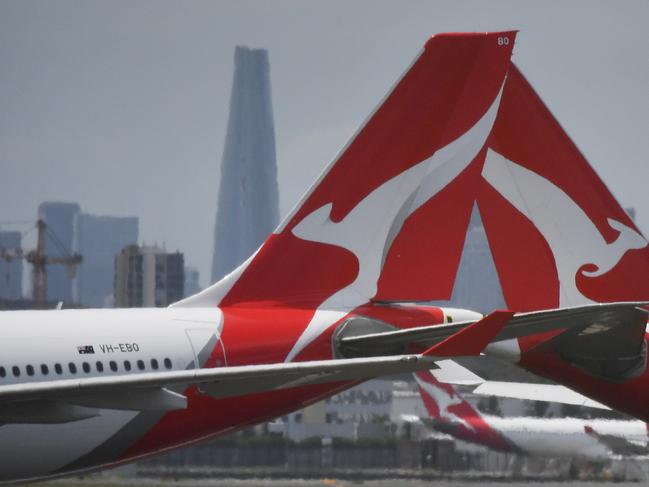 Qantas aircraft are seen at Sydney Airport, Thursday, 24 December 2020. Authorities are urgently investigating how a Qantas crew member contracted Covid-19 after arriving in Darwin from Paris and then flying to Sydney without being tested or quarantined. Federal health authorities are working with Qantas to understand how the man, who landed in Darwin on 17 December after working on a repatriation flight from Paris, became infected. Picture - Sam Mooy/The Australian Newspaper