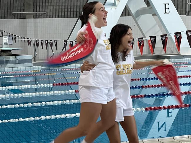 St Rita's captains Jemima Irvine and Sienna Bressington leap for joy.