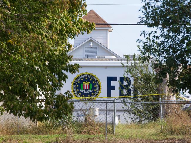 The entrance of the First Baptist Church is obscured by an FBI truck. Picture: AP