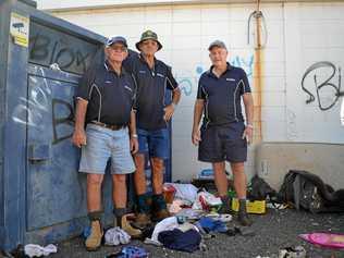 CONTAINERS TRASHED: Lifeline volunteers Darryl Frizzell, Don Lee and Clive Jackman with the Lifeline donation containers. Picture: Meg Gannon