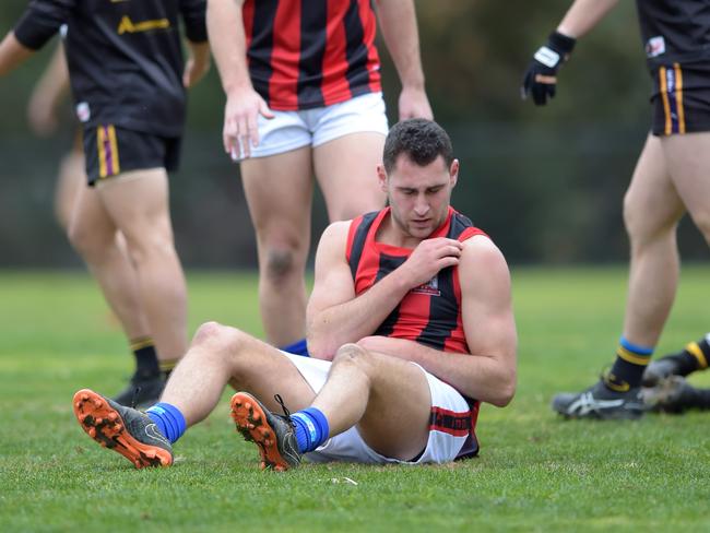 Julian Soccio after injuring his shoulder in the second quarter. Picture: Steve Tanner