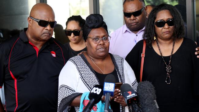 Muriel Namok (centre), the mother of Maliq Nicholas Floyd Namok-Malamoo, or Meeky as he was affectionately known, who died in Cairns in 2020.