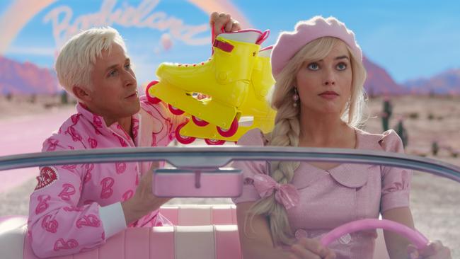 Ryan Gosling as Ken and Margot Robbie as Barbie in a scene from the movie Barbie.