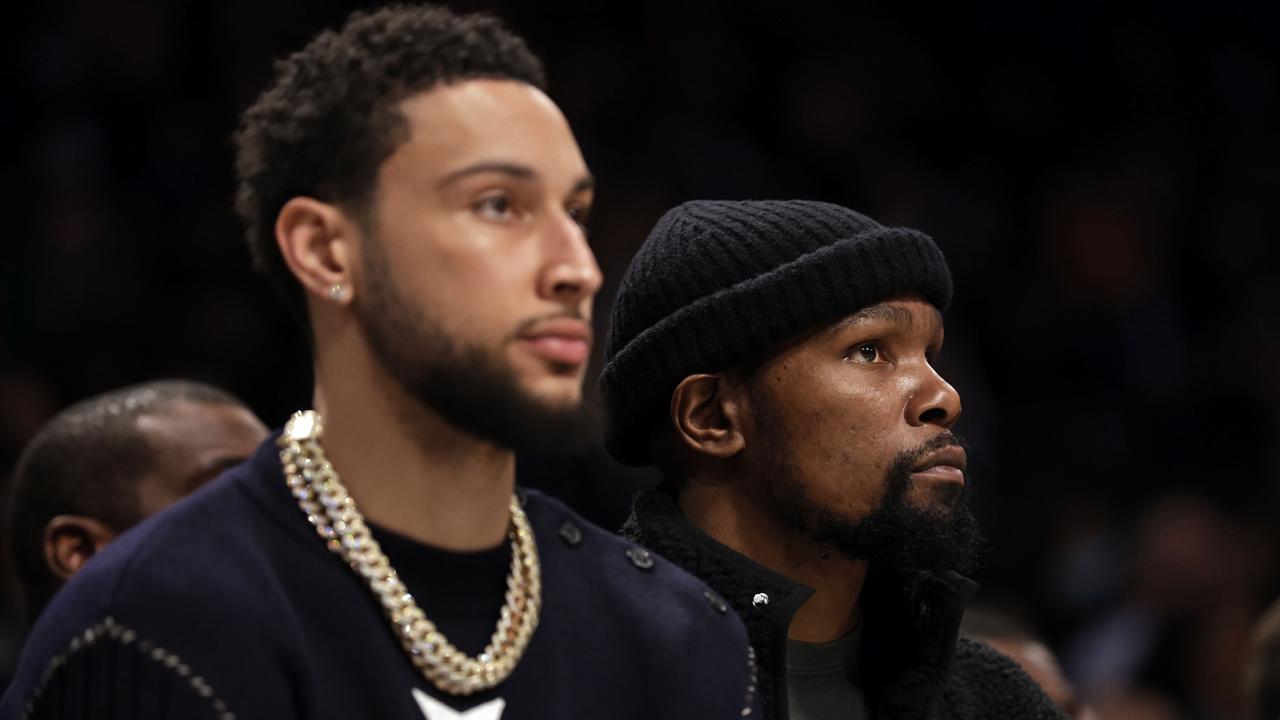 NEW YORK, NEW YORK - FEBRUARY 24: Kevin Durant #7 of the Brooklyn Nets looks on from the bench next to Ben Simmons #10 of the Brooklyn Nets against the Boston Celtics during the first half at Barclays Center on February 24, 2022 in New York City. NOTE TO USER: User expressly acknowledges and agrees that, by downloading and or using this Photograph, user is consenting to the terms and conditions of the Getty Images License Agreement. Adam Hunger/Getty Images/AFP == FOR NEWSPAPERS, INTERNET, TELCOS &amp; TELEVISION USE ONLY ==