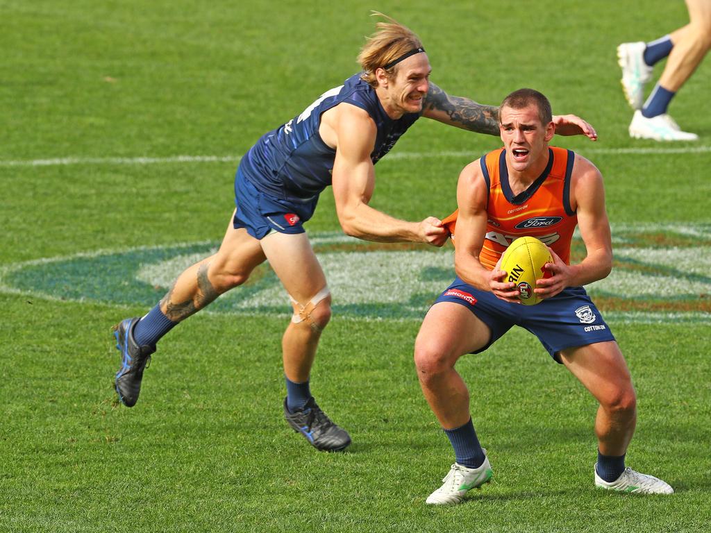 Tom Stewart puts pressure on Ted Clohesy during the Cats Thursday training session. Picture: Alison Wynd
