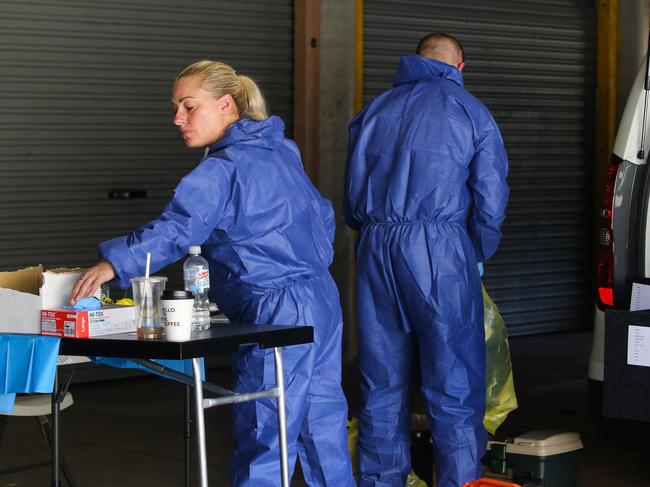 Forensics at the unit block in Wyong on the Central Coast, where a man and woman have been arrested and an investigation is underway after the body of a man was located and a woman was allegedly kidnapped. Picture: Gaye Gerard