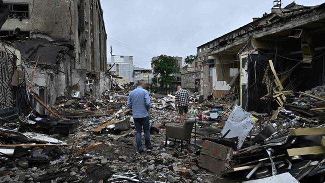 Local residents walk among debris following a Russian missile strike in the centre of Kramatorsk on June 29, 2023, amid the Russian invasion of Ukraine. Picture: AFP