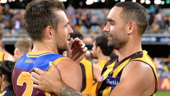 Luke Hodge and Shaun Burgoyne embrace after the Round 9 match in 2018.