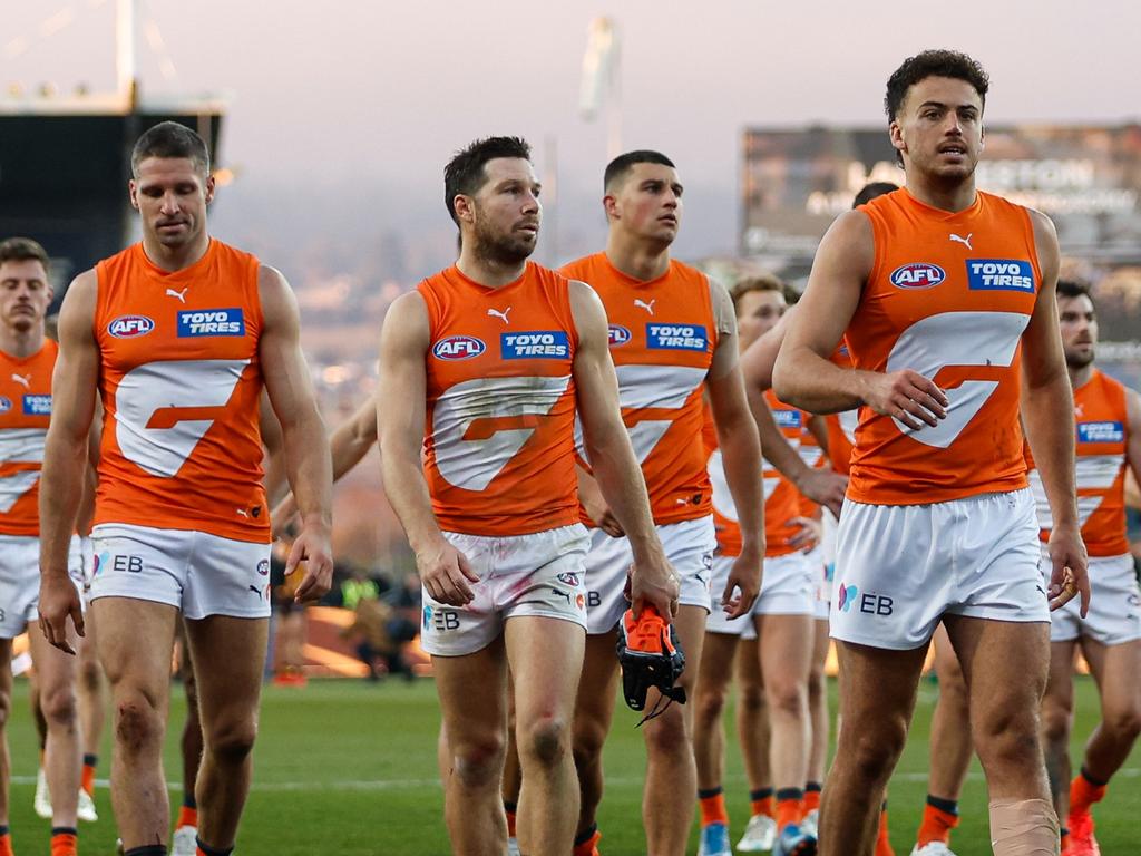 MELBOURNE, AUSTRALIA – JUNE 08: The Giants leave the field looking dejected after a loss during the 2024 AFL Round 13 match between the Hawthorn Hawks and the GWS GIANTS at UTAS Stadium on June 08, 2024 in Launceston, Australia. (Photo by Dylan Burns/AFL Photos via Getty Images)