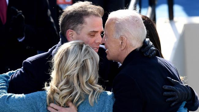 US President Joe Biden hugs his son Hunter Biden and US First Lady Jill Biden after being sworn in as the 46th US President, on January 20, 2021. Picture: Olivier Douliery/AFP)