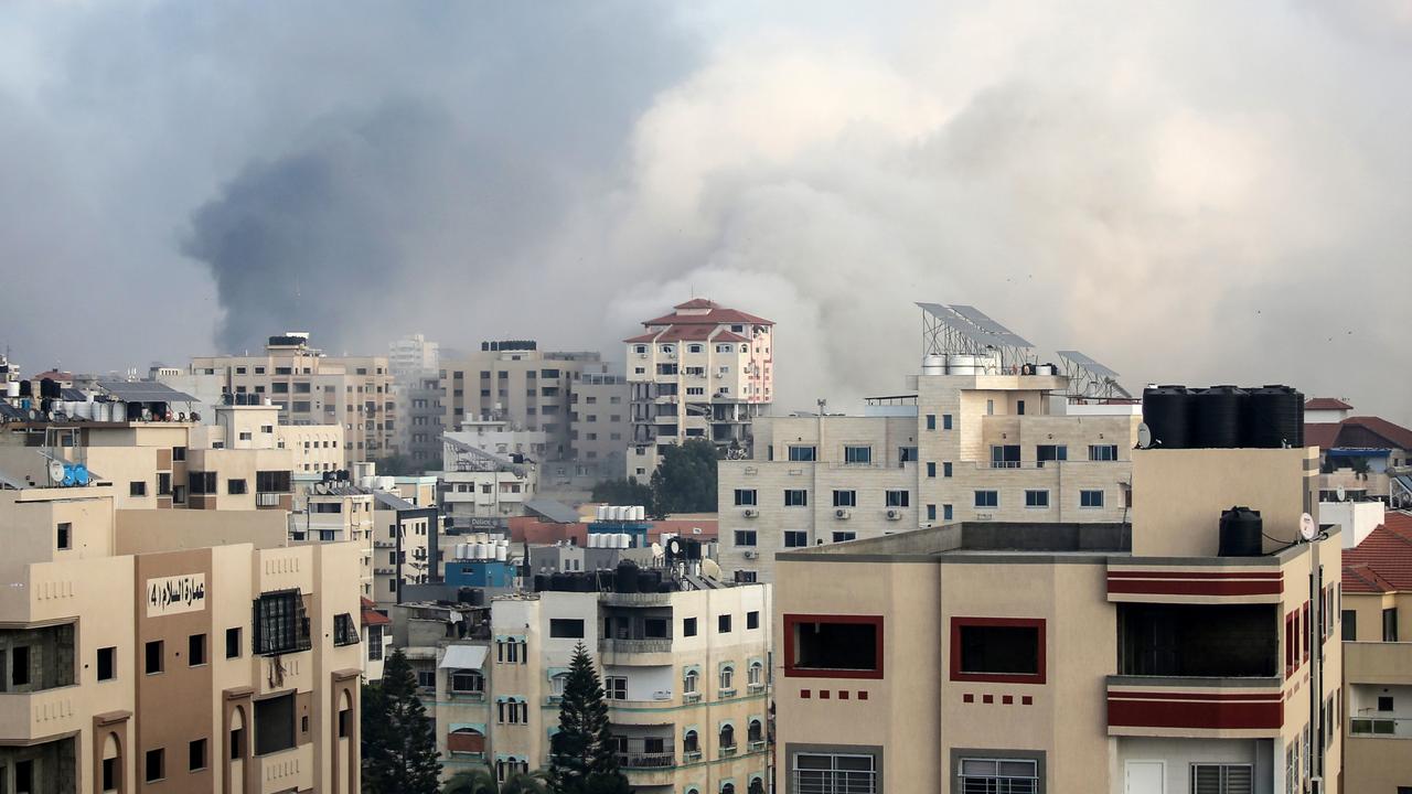 Israeli aircraft bomb the Carmel residential tower in Gaza City, Gaza. Photo: Ahmad Hasaballah/Getty Images.