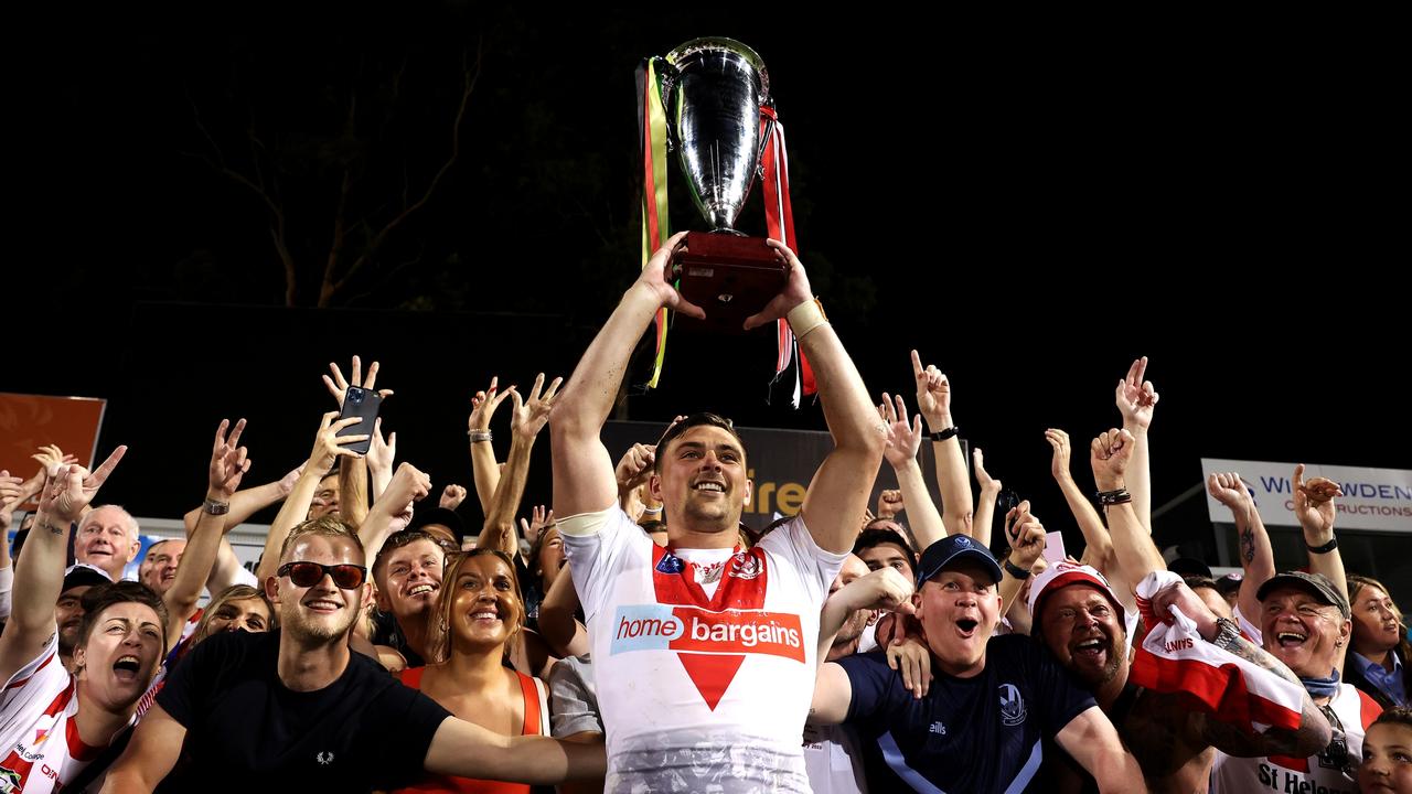 Lewis Dodd holds aloft the World Club Challenge trophy after guiding St Helens to victory over the Panthers at BlueBet Stadium on February 18, 2023. Picture: Getty Images