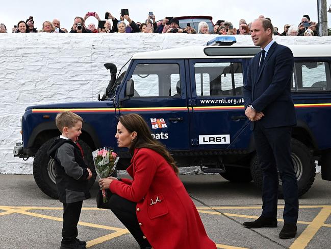 The excited young royal fan presented Kate with a posy of flowers. Picture: AFP