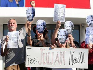 Free Julian Assange organiser Dean Jeffrey's (left) with his fellow protesters. Picture: Scott Powick