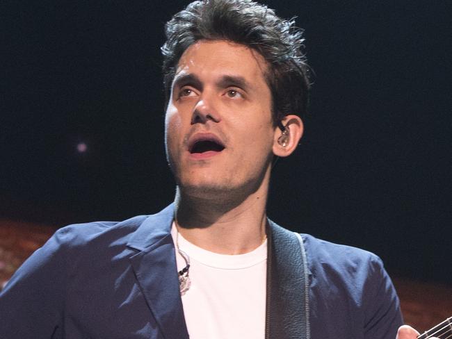 FILe - In this April 7, 2017 file photo, John Mayer performs in concert during his "The Search for Everything Tour" in Philadelphia. Mayer has been hospitalized for an emergency appendectomy. The Grammy-winning musician was admitted to the hospital on Tuesday, Dec. 5, according to a rep. The singer-guitarist was due to perform later that night at a concert with the Dead & Company, but that date has now been postponed. (Photo by Owen Sweeney/Invision/AP, File)