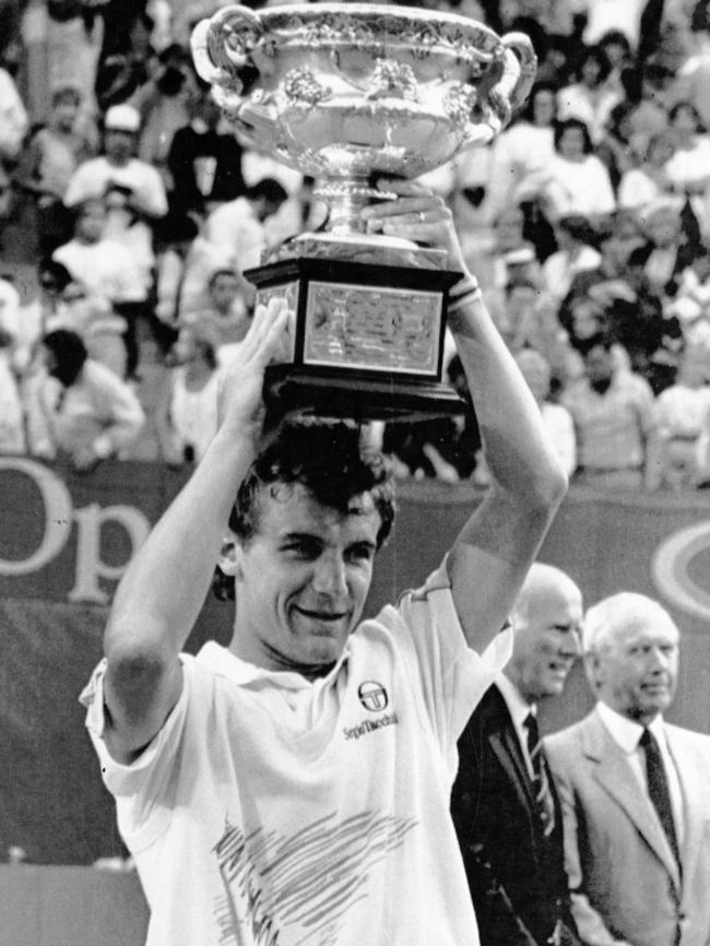 Swede Mats Wilander holds his trophy aloft.