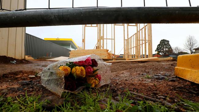 Floral tribute at the Fullarton building site where Clyde Norris was working before the tragedy. Picture: Simon Cross