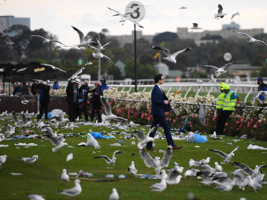 Racegoers are seen at the end of the Lexus Melbourne Cup Day, as part of the Melbourne Cup Carnival, at Flemington Racecourse in Melbourne, Tuesday, November 6, 2018. (AAP Image/Dan Himbrechts) NO ARCHIVING, EDITORIAL USE ONLY