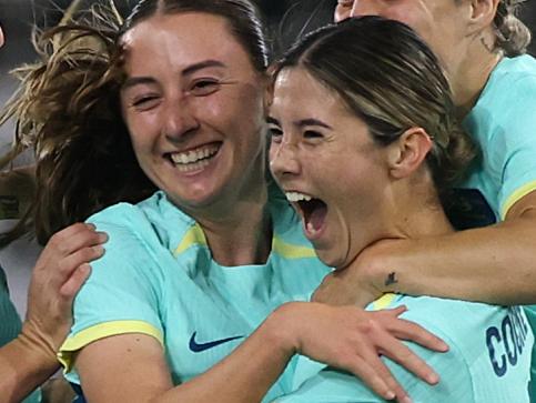 DUISBURG, GERMANY - OCTOBER 28: Kyra Cooney-Cross of Australia celebrates scoring her team's first goal with teammates  during the Women's international friendly match between Germany and Australia at Schauinsland-Reisen-Arena on October 28, 2024 in Duisburg, Germany. (Photo by Alex Grimm/Getty Images)