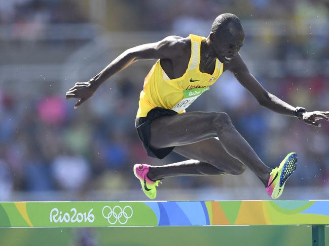 (FILES) Uganda's Benjamin Kiplagat competes in the Men's 3000m Steeplechase Round 1 during the athletics event at the Rio 2016 Olympic Games at the Olympic Stadium in Rio de Janeiro on August 15, 2016. Ugandan athlete Benjamin Kiplagat has been found dead in Kenya, police said on December 31, 2023, with local media reports saying he had been murdered. (Photo by Fabrice COFFRINI / AFP)