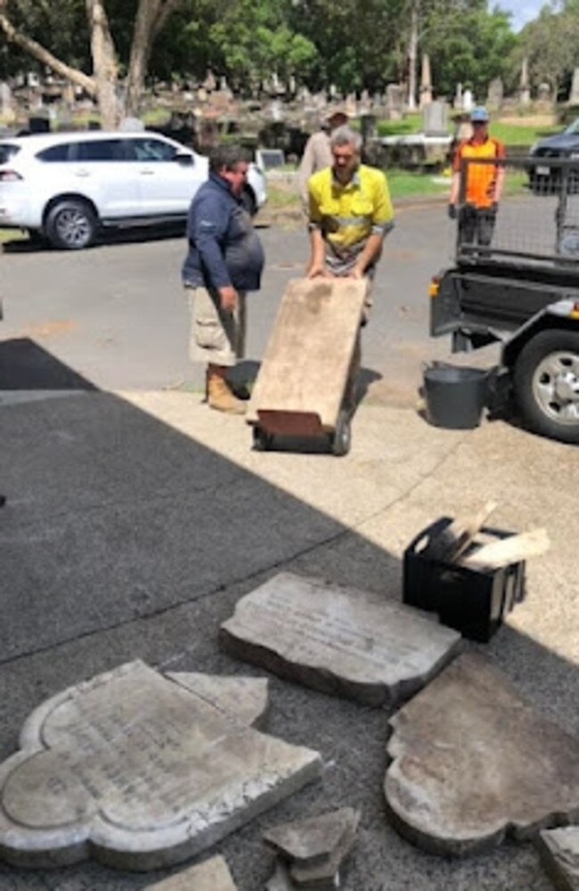 Volunteers help dig up and remove lost headstones from the Albany Creek area following the 2022 Brisbane floods. Picture: Christopher Dawson/Time Travel Club