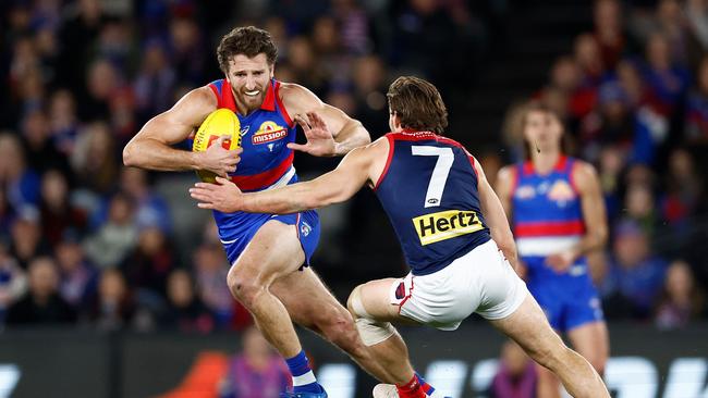 MELBOURNE, AUSTRALIA - AUGUST 02: Marcus Bontempelli of the Bulldogs evades Jack Viney of the Demons during the 2024 AFL Round 21 match between Footscray and the Melbourne Demons at Marvel Stadium on August 02, 2024 in Melbourne, Australia. (Photo by Michael Willson/AFL Photos via Getty Images)