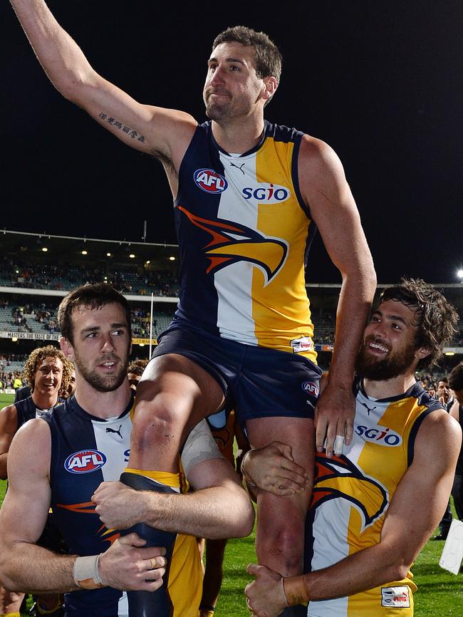 2024 AFL premiership cup ambassador Josh Kennedy (right) chaired off Eagles great Dean Cox in his final game in 2014. Picture: Daniel Wilkins