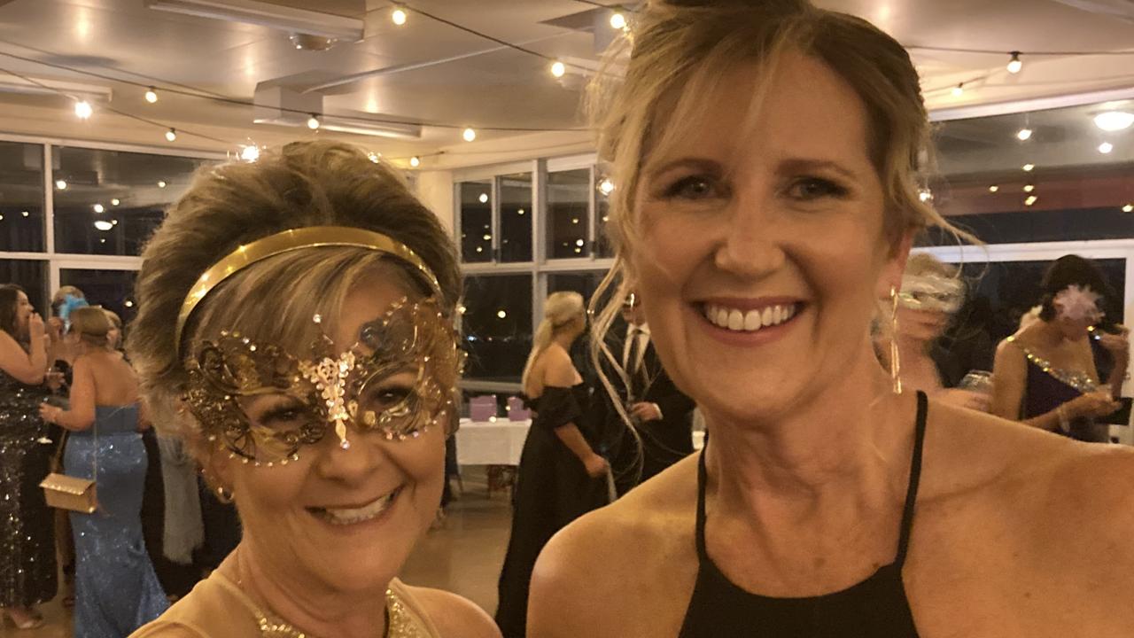 Amanda Finch and Jodie Field celebrate at the Gympie RSL Masked Ball, April 29 2023.