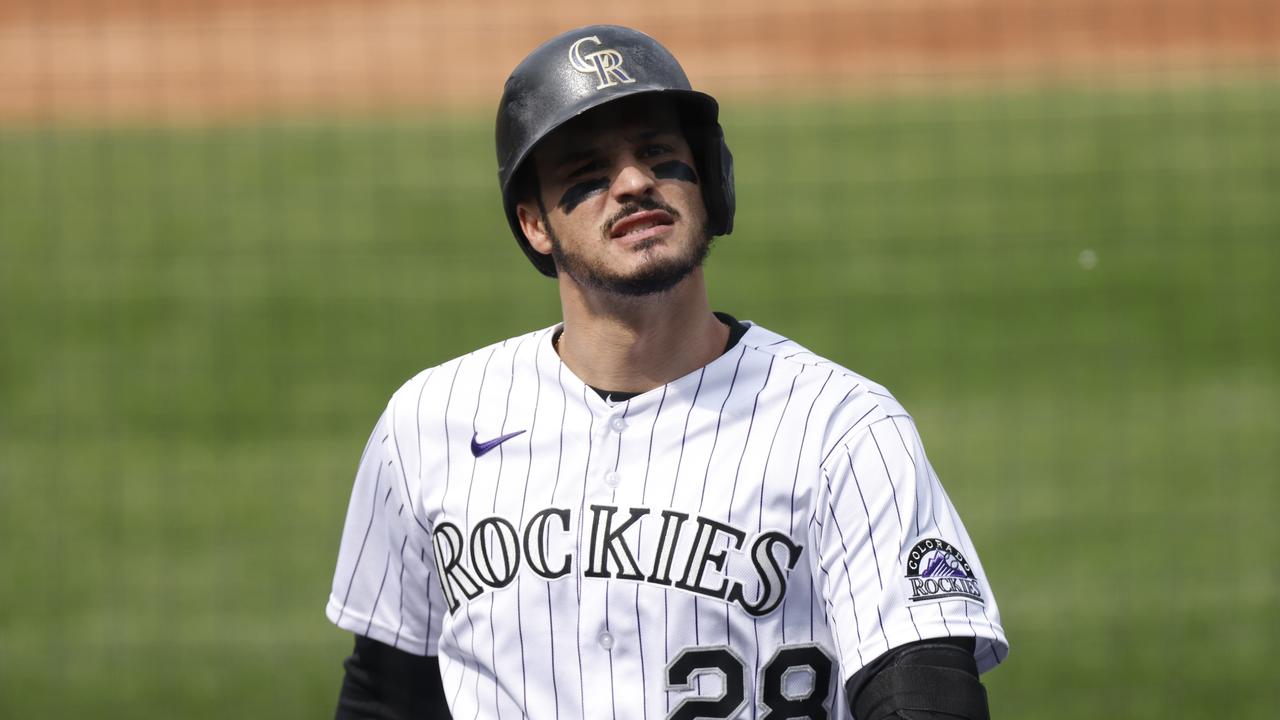 Colorado is trading away its superstar Nolan Arenado - and paying $65 million as well. (Photo by Justin Edmonds/Getty Images)