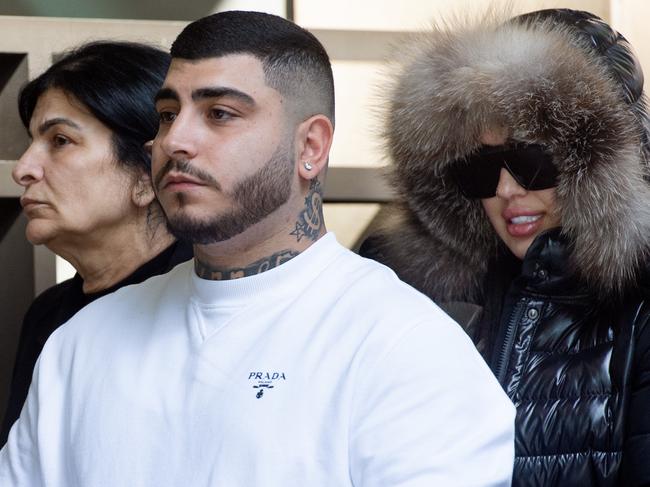 MELBOURNE AUSTRALIA - Newswire Photos DECEMBER 20TH 2023 : Jesse Marrogi (front) and Madlin Enwiya (left), brother and mum of crime boss and murderer George Marrogi outside Melbourne Magistrates Court. PICTURE : NCA Newswire / Nicki Connolly