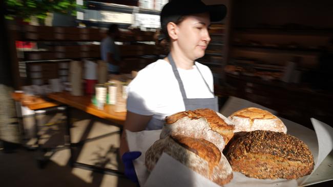 A member of staff carries loafs of bread at Gail's bakery-and-cafe in Queen’s Park, London. Picture: Getty Images