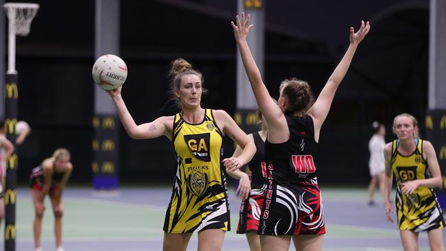 Rachael Campion offloads the ball in the Cairns Netball match between North Cairns Tigers and Cairns Saints. PICTURE: BRENDAN RADKE